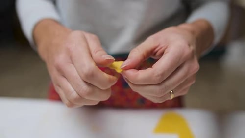 Crop woman with tasty tortellini at home