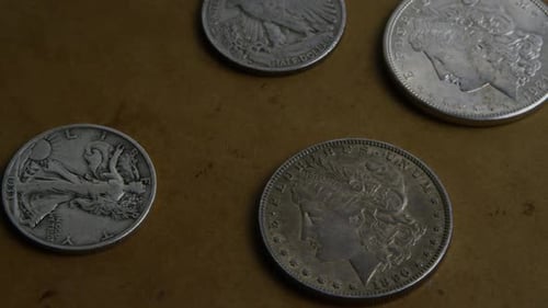 Rotating stock footage shot of antique American coins - MONEY 0070