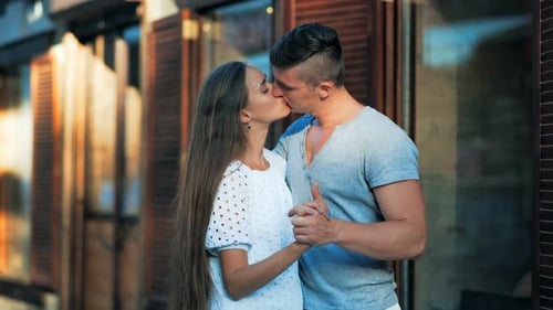 Young Couple in Love Hugging in the Old Part of Town