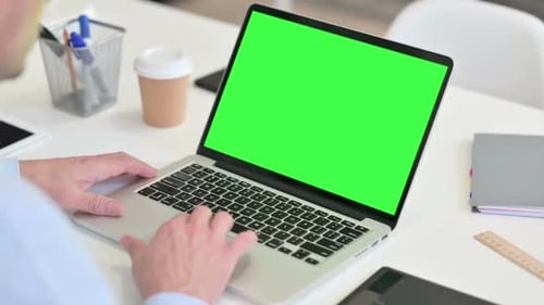 Typing on Laptop with Green Screen