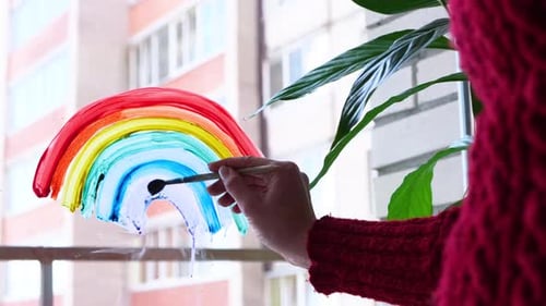 Hand Painting a Colorful Rainbow on Window