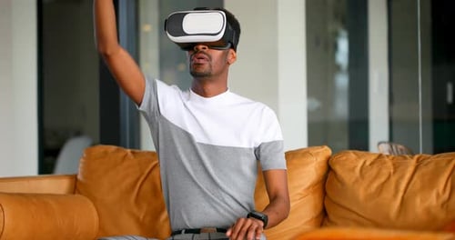 Man Enjoys Virtual Reality Experience at Home