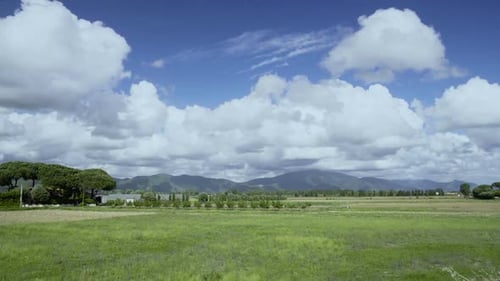 Beautiful Landscape in Italy, View of Lawn, Mountain and Cloudy Sky, Summer Time