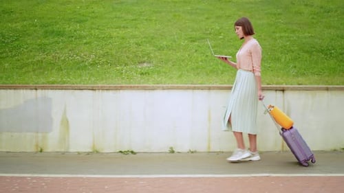 Traveler Walks in Town