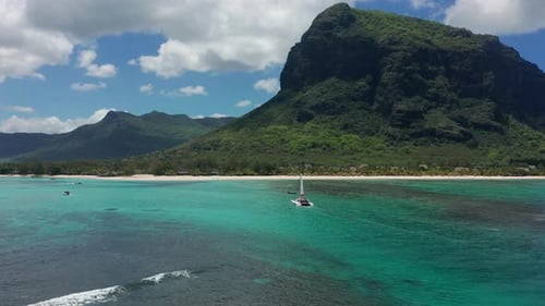 Catamaran in Turquoise Water Against the Background of the Paradise Island Mauritius