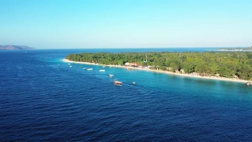 Wide angle drone island view of a white sandy paradise beach and blue sea background in colorful