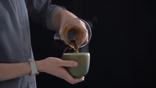 Pouring Hot Beverage into Mug Close Up