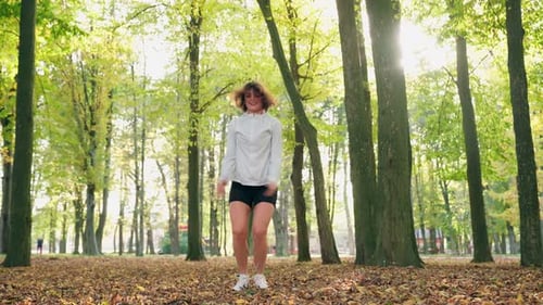 Woman Moving Actively During Training at Park