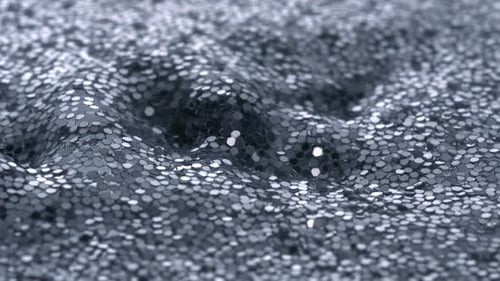 Wellen in Wasser gefüllt mit Glitzer, Zeitlupe