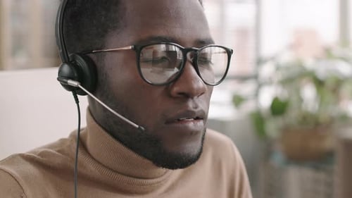 African Male Operator Working in Call Center