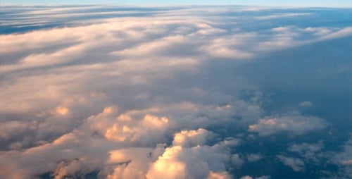 Clouds Shimmering in the Sunrise from High Above