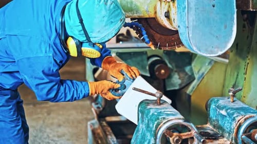 Industrial Worker at Factory on Granite Manufacture