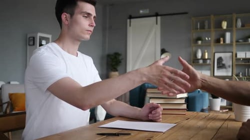 Young Man Shaking Hand