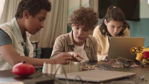 Teens Working on Technology Project Together
