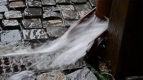 Water Flowing from a Pipe into Stone Drain