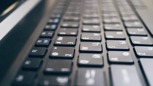 Close-up keyboard with Russian and English layout.