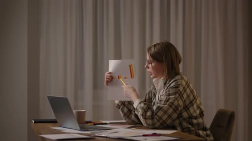 Woman Presenting Graph During Online Meeting