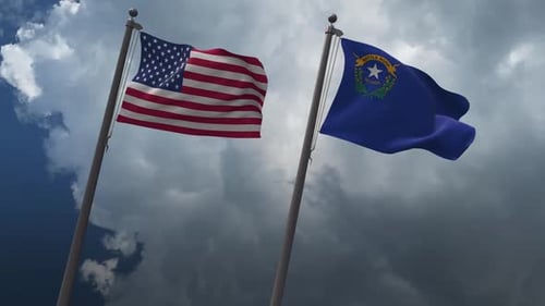 United States and Nevada Flags Waving on Flagpoles Against Cloudy Sky