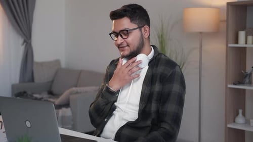Young Adult Video Conferencing At Home Office