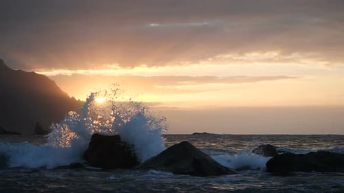 Waves Rise in the Air at Beautiful Sunset Light at Benijo Beach in Tenerife, Canary Islands