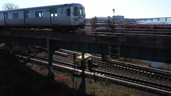 A low angle shot of a New York City subway on an elevated track in ...