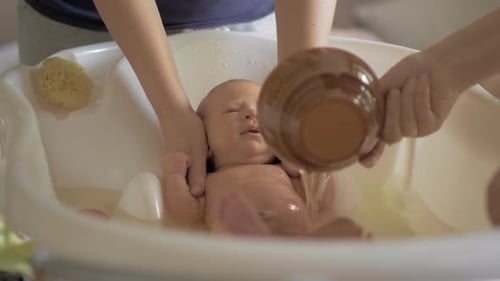 Infant Receiving Bath at Home