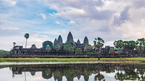 Daytime time lapse at Angkor Wat main facade reflection on water pond, Cambodia