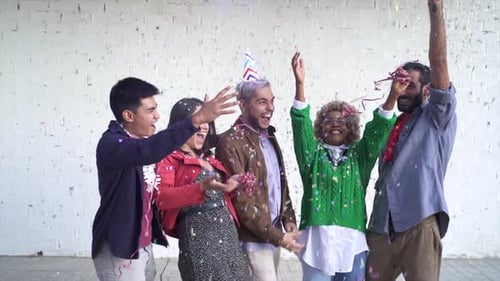 Friends Celebrate Together as Confetti Falls at Party