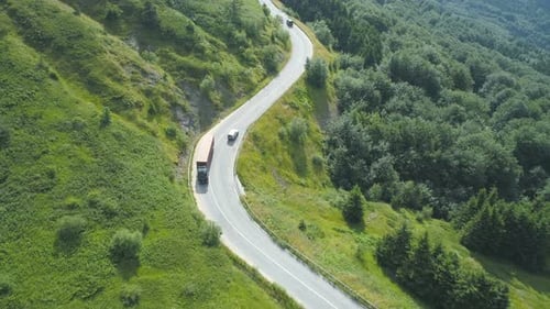 Truck Driving Through Mountain Pass