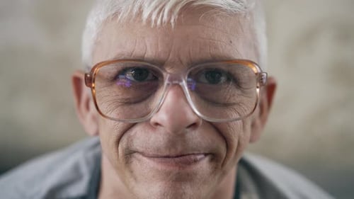 Portrait of Aged Man in Glasses