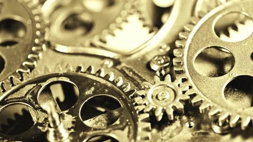 Close Up of Rotating Gold Gears