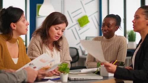 Diverse Team Collaborating on Business Strategy in Office