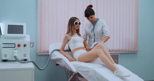 Woman Getting Laser Hair Removal Treatment in Office