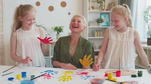 Grandma and Kids Making Handprints