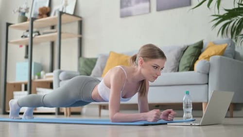 Woman Doing Forearm Plank in Living Room