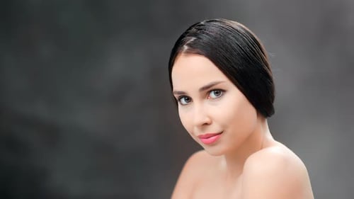 Adorable Sexy Naked Woman with Pure Skin Natural Beauty Smiling Posing at Black Studio Background