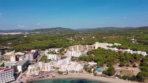 Aerial footage of the beautiful town of Ibiza in Spain showing the beach front