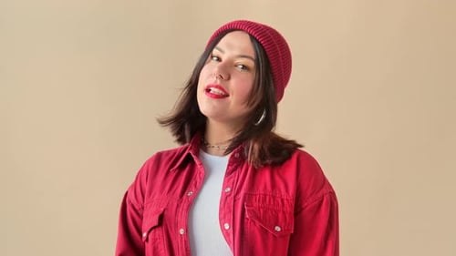 Stylish Woman Poses in a Red Beanie