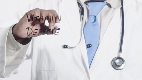 Asian Doctor Writes Vitamin Deficiency