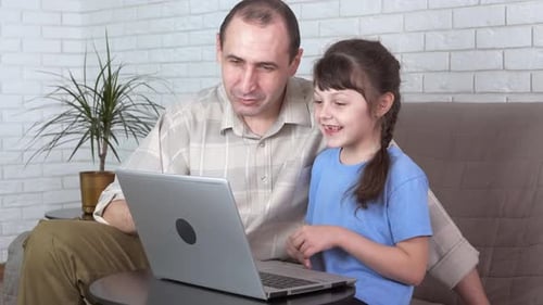 Girl and Man Video Chatting on Laptop
