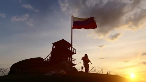 Soldado ruso vigilando la frontera al atardecer