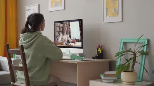 African Teenage School Girl Remote Learning Online Class with Web Tutor