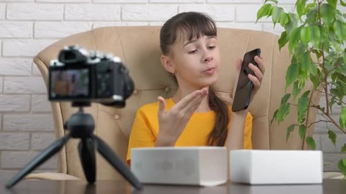Girl Vlogging About Phone in Home Studio