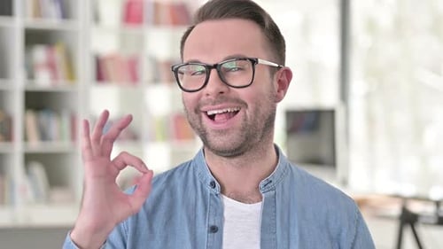 Smiling Man Giving OK Hand Gesture