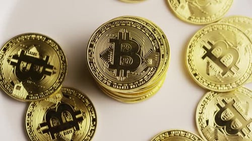 Rotating shot of Bitcoins (digital cryptocurrency) - BITCOIN