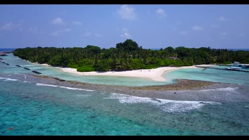 Aerial above travel of tranquil shore beach adventure by blue ocean and white sandy background of a