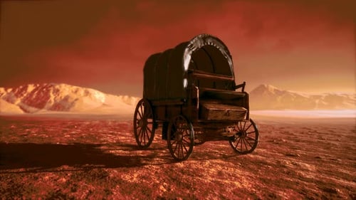 Vagón retro cubierto de lona en el desierto al atardecer