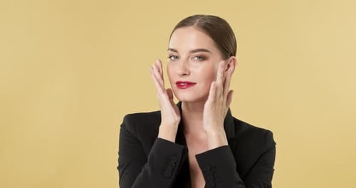 Confident Woman Posing and Smiling in Black Blazer