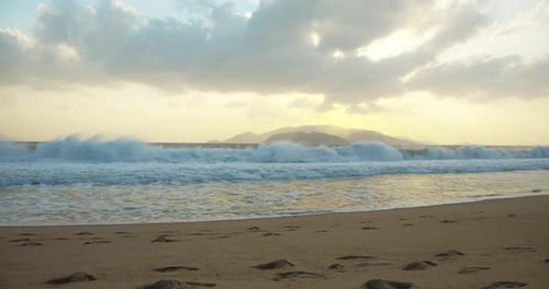 The Trail of the Sun on the Waves in the Sand