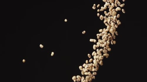 A Lot Of A White Beans Up And Down On A Black Background